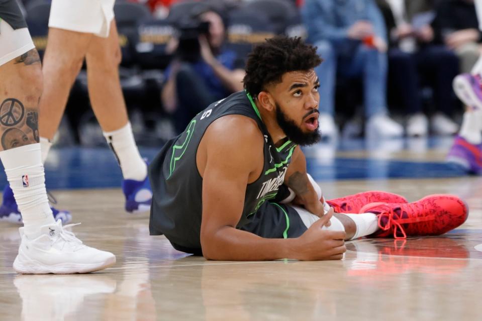 Karl-Anthony Towns on the floor after suffering calf injury