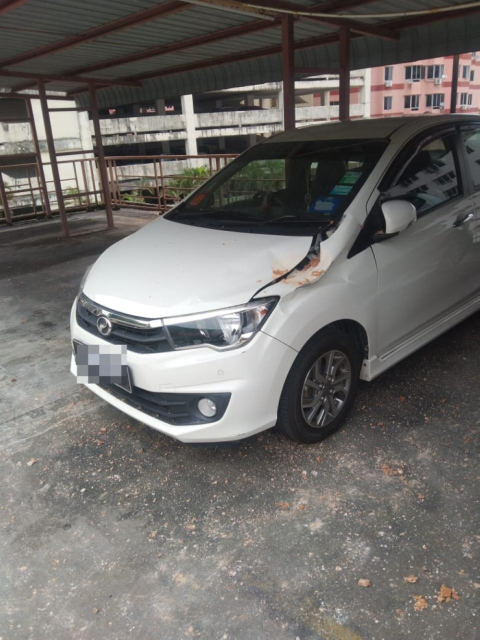 A photograph shows another vehicle damaged by the blast. — Picture by Ronnie Lim Hai Seng