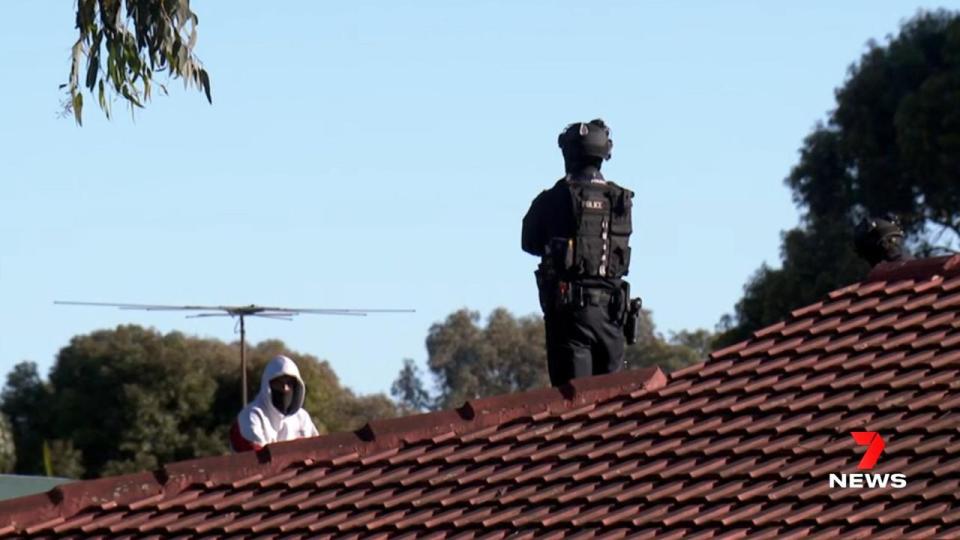 STAR Group officers have surrounded a Paralowie home where a wanted suspect is cornered on a rooftop, wanted over a rideshare vehicle carjacking. Picture 7NEWS