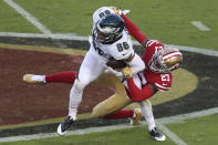 Philadelphia Eagles tight end Zach Ertz (86) is grabbed by San Francisco 49ers cornerback Dontae Johnson (27) during the first half of an NFL football game in Santa Clara, Calif., Sunday, Oct. 4, 2020. (AP Photo/Jed Jacobsohn)