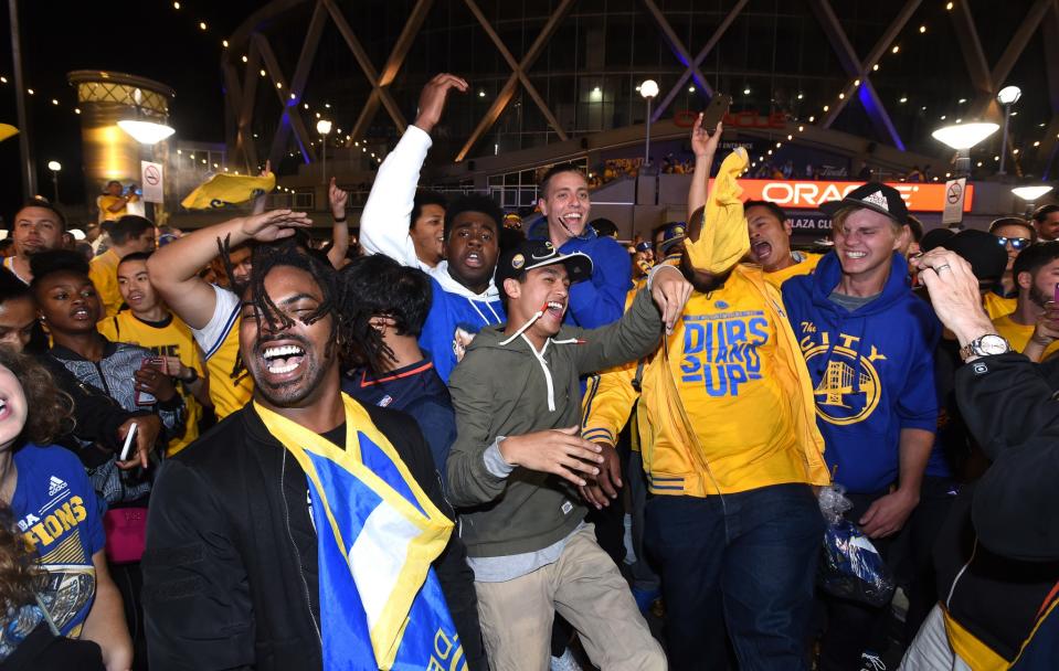 Warriors fans celebrate the team's win in Game 5 of the 2017 NBA Finals to clinch the 2017 NBA championship. (AP)