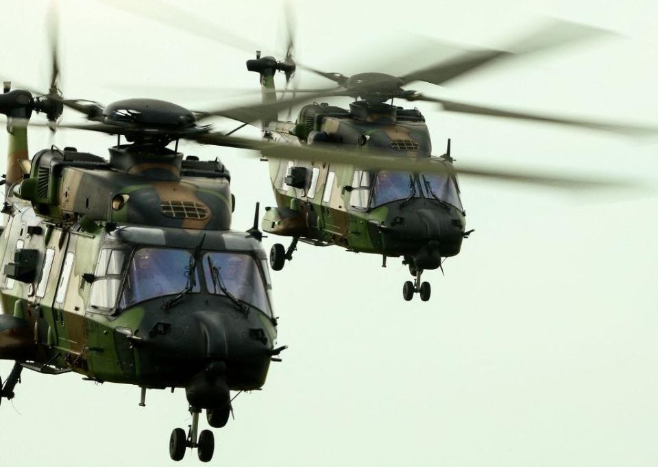 Two NH 90 "Caiman" helicopter fly during the military maneuver "Orion", over the camp of Sissonne, northeastern France, on May 2, 2023.