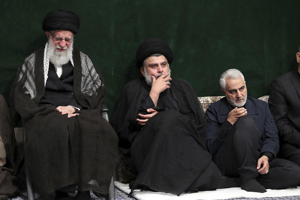 In this picture released by the official website of the office of the Iranian supreme leader, Supreme Leader Ayatollah Ali Khamenei, left, Iraqi Shiite cleric Muqtada al-Sadr, center, and commander of Iran's Quds Force, Qassem Soleimani attend a mourning ceremony commemorating Ashoura, the death anniversary of Hussein, the grandson of Prophet Muhammad, in Tehran, Iran, Tuesday, Sept. 10, 2019. Shiite Muslims around the world are observing Ashoura, one of the most sacred religious holy days for their sect, which commemorates the death of Hussein, at the Battle of Karbala in present-day Iraq in the 7th century. (Office of the Iranian Supreme Leader via AP)