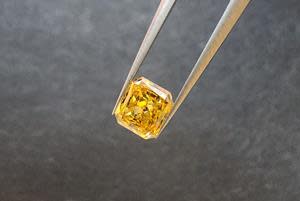 0.21 carat fancy colour rectangular radiant-cut diamond. The original rough carat weight was 0.55 carats and the diamond was recovered from the 2021 bulk sample of the Q1-4 kimberlite at the Naujaat Project, Nunavut.