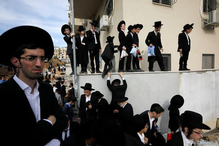 Ultra-Orthodox Jews gather during the funeral ceremony of prominent spiritual leader Rabbi Aharon Yehuda Leib Steinman, who died on Tuesday at the age of 104, in Bnei Brak near Tel Aviv, Israel December 12, 2017. REUTERS/Amir Cohen