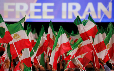 FILE PHOTO: Supporters of Maryam Rajavi, president-elect of the National Council of Resistance of Iran (NCRI), attend a rally in Villepinte, near Paris, France, June 30, 2018. REUTERS/Regis Duvignau/File Photo