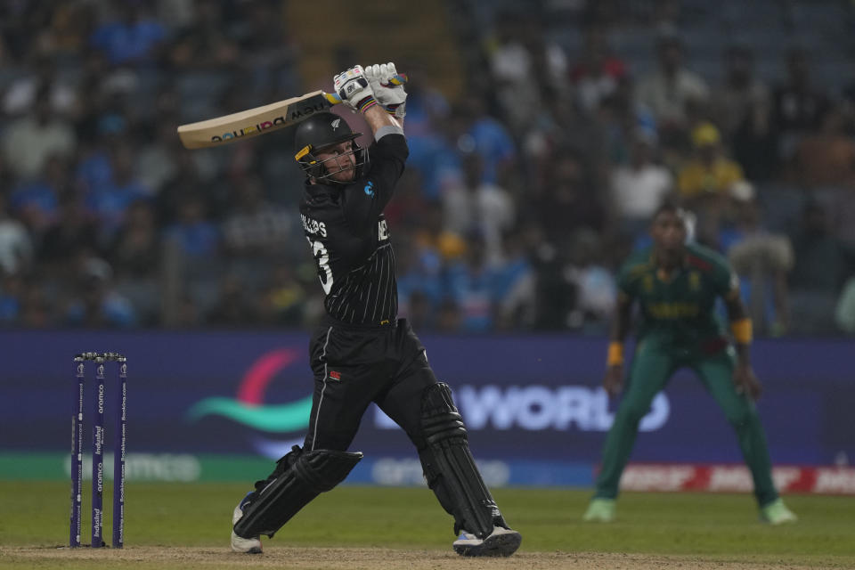 New Zealand's Glenn Phillips hits a six during the ICC Men's Cricket World Cup match between New Zealand and South Africa in Pune, India, Wednesday, Nov.1, 2023. (AP Photo/Manish Swarup)