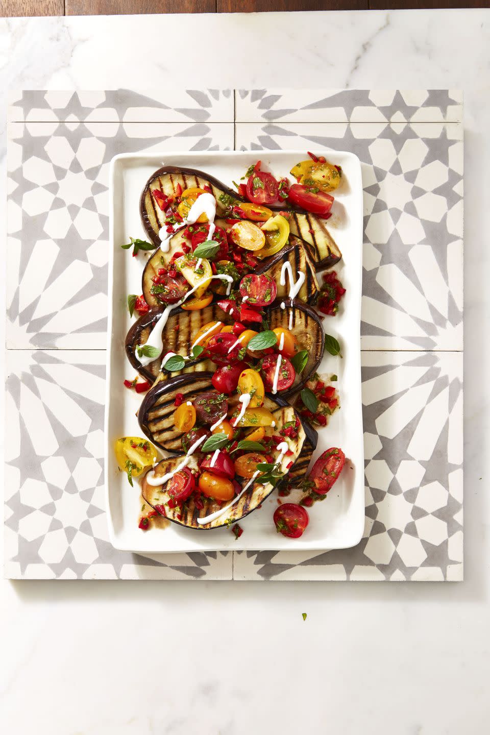 <p>Here's a grilled entree for your vegetarian friends that the meat eaters will want to eat, too. Smoky grilled eggplants, fresh juicy tomatoes, and cool and creamy yogurt for the win.</p><p><em><a href="https://www.goodhousekeeping.com/food-recipes/a39935/cayenne-grilled-eggplant-with-fresh-tomato-salad-recipe/" rel="nofollow noopener" target="_blank" data-ylk="slk:Get the recipe for Cayenne Grilled Eggplant with Fresh Tomato Salad »;elm:context_link;itc:0;sec:content-canvas" class="link ">Get the recipe for Cayenne Grilled Eggplant with Fresh Tomato Salad »</a></em></p><p><strong>RELATED: </strong><a href="https://www.goodhousekeeping.com/food-recipes/g3195/eggplant-recipes/" rel="nofollow noopener" target="_blank" data-ylk="slk:25+ Dishes That Will Make You Fall in Love with Eggplant;elm:context_link;itc:0;sec:content-canvas" class="link ">25+ Dishes That Will Make You Fall in Love with Eggplant</a></p>