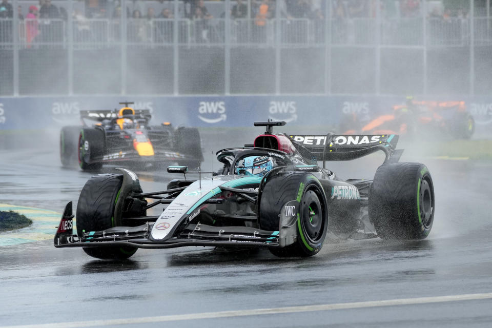 Mercedes driver George Russell, right, of the United Kingdom, leads as Red Bull driver Max Verstappen, of the Netherlands, follows during the Canadian Grand Prix Formula 1 car race, in Montreal, Sunday, June 9, 2024. (Christinne Muschi/The Canadian Press via AP)