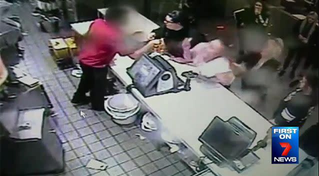 The woman in white is attacked from behind my two other women. Photo: 7 News