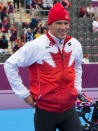 Canada's Simon Whitfield gets prepared in the transition area for the men's triathlon at the 2012 London Olympic Games, August 7, 2012. Whitfield crashed on the bicycle portion of the race and withdrew from the competition. COC Photo: Jason Ransom