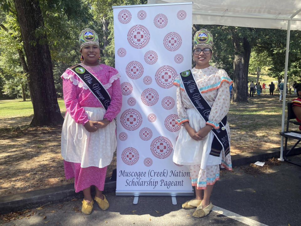 Miss Muscogee (Creek) Nation Tema Yargee, 20, and Jr. Miss Muscogee (Creek) Nation, Chenoa Barnett, 17, pose at the Ocmulgee Indigenous Celebration on Saturday, Sept. 17, 2022, in Macon, Ga. (AP Photo/Sharon Johnson)