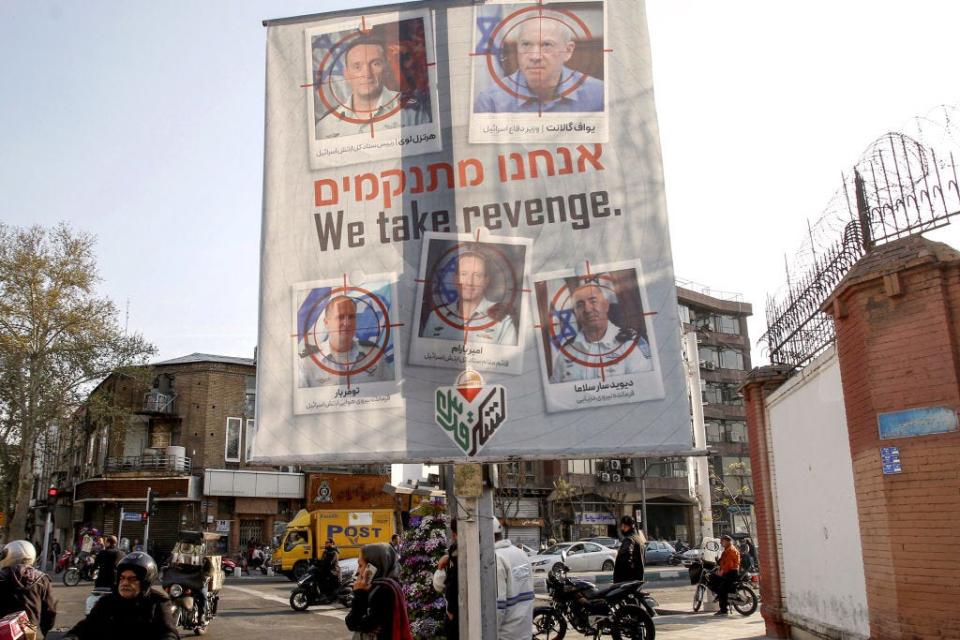 A banner displaying pictures of Israeli army officials with their faces encircled by a red crosshair icon, hang in Tehran on April 2, 2024 following a suspected Israeli strike in Damascus.