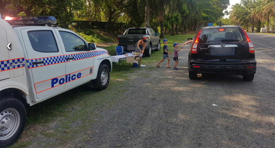 Jack and Will Reilly serve up lemonade to drivers who were breath tested in Port Douglas.