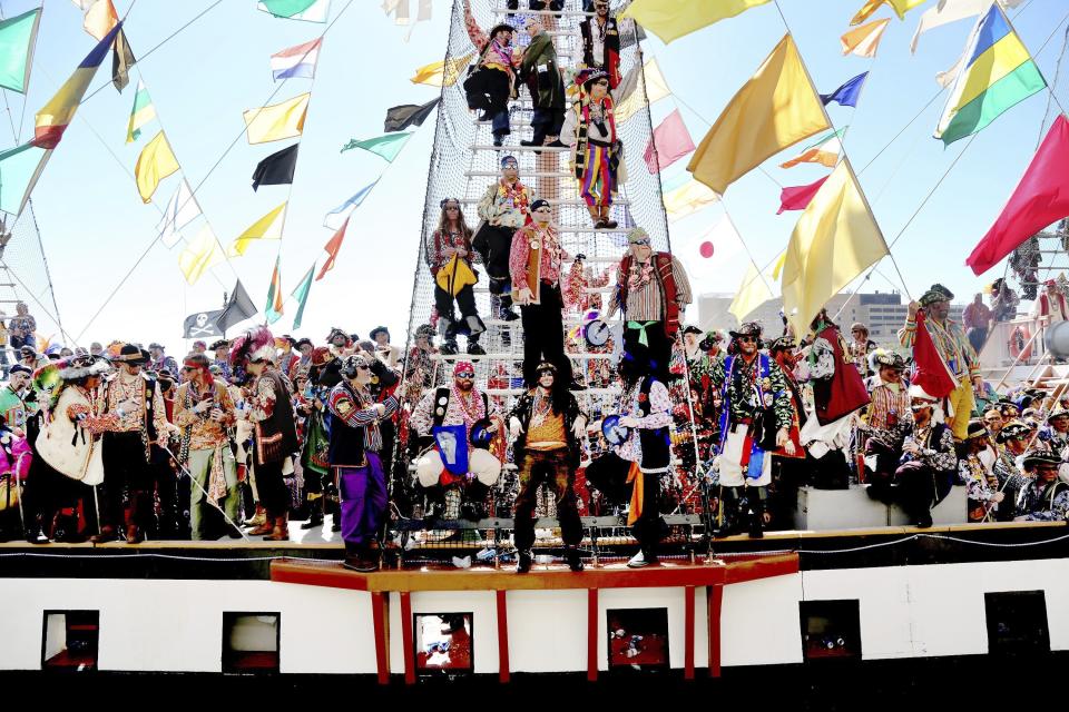 The Jose Gasparilla pirate ship, carrying members of Ye Mystic Krewe of Gasparilla, arrives at the Tampa Convention Center during the 103nd Gasparilla Invasion and Parade of the Pirates on Saturday, Jan. 25, 2020, in Tampa. This year's event was postponed and then canceled due to the coronavirus pandemic. The group now says the next one won't be held until January 2022. (Douglas R. Clifford/Tampa Bay Times via AP)