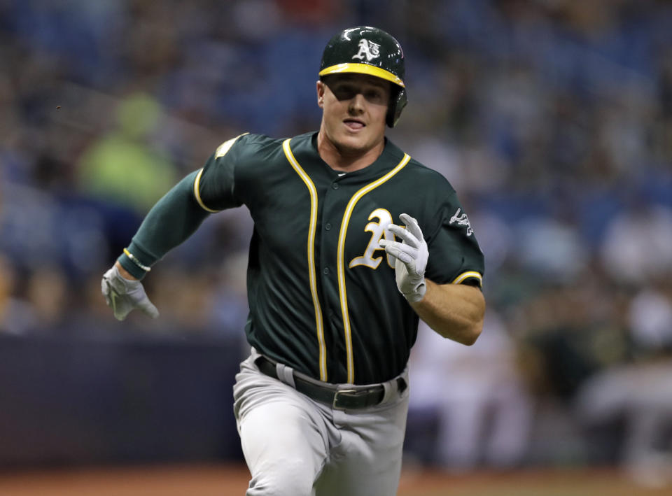 Oakland Athletics' Matt Chapman races home to score on an RBI single by Matt Olson off Tampa Bay Rays pitcher Ryan Yarbrough during the fourth inning of a baseball game Friday, Sept. 14, 2018, in St. Petersburg, Fla. (AP Photo/Chris O'Meara)