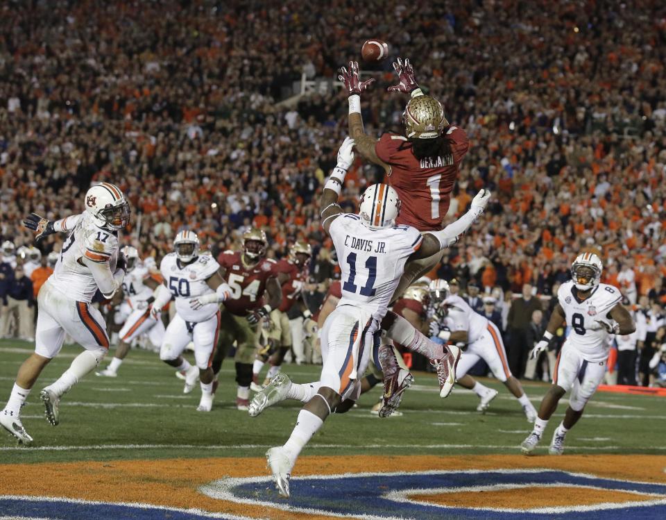Florida State's Kelvin Benjamin catches the game-winning touchdown pass during the second half of the NCAA BCS National Championship college football game against Auburn Monday, Jan. 6, 2014, in Pasadena, Calif. (AP Photo/Chris Carlson)