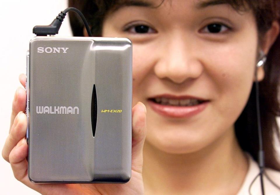 person holding a walkman