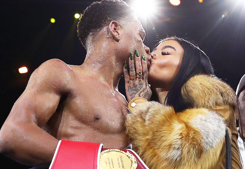 Devin Haney, pictured here celebrating with girlfriend India Love after his victory over George Kambosos.