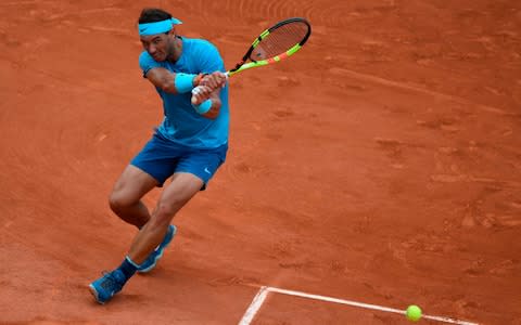 Spain's Rafael Nadal plays a backhand return to Argentina's Guido Pella during their men's singles second round match on day five of The Roland Garros 2018 French Open tennis tournament in Paris on May 31, 2018 - Credit: AFP