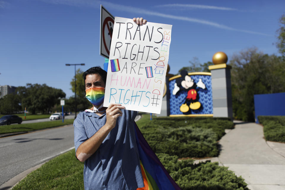 ORLANDO, FL - MARCH 22: Disney employee Nicholas Maldonado holds a sign while protesting outside of Walt Disney World on March 22, 2022 in Orlando, Florida. Employees are staging a company-wide walkout today to protest Walt Disney Co.&#39;s response to controversial legislation passed in Florida known as the &#x00201c;Don&#x002019;t Say Gay&#x00201d; bill. (Photo by Octavio Jones/Getty Images)