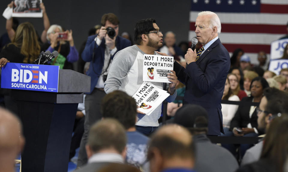 Then-Democratic presidential hopeful Joe Biden talks with a protester objecting to his stance on deportations in Greenwood, South Carolina, on Thursday, November 21, 2019. / Credit: Meg Kinnard / AP