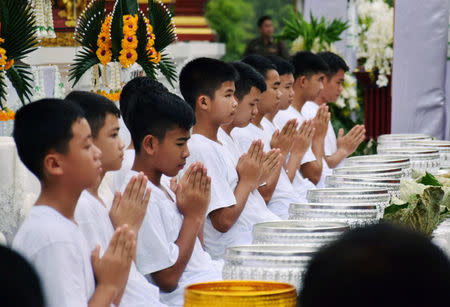 Members of the soccer team rescued from a cave are seen during ordination ceremony, in a temple at Mae Sai, in the northern province of Chiang Rai, Thailand July 24, 2018. REUTERS/Stringer