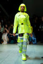 <p>Model wears a lime green jacket, matching hair and metallic silver and green moom boots at Jeremy Scott’s Fall 2018 show. (Photo: Getty) </p>