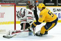 Nashville Predators defenseman Roman Josi (59) scores the winning goal against Chicago Blackhawks goaltender Malcolm Subban (30) in overtime of an NHL hockey game Tuesday, Jan. 26, 2021, in Nashville, Tenn. The Predators won 3-2. (AP Photo/Mark Humphrey)