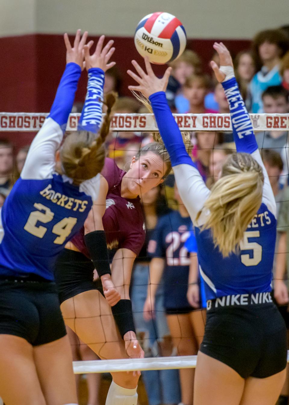 IVC's Kenna Wollard puts the ball between Limestone's Ella Karmenzind (24) and Phoebe Sewell during their volleyball match Wednesday, Aug. 31, 2022 in Chillicothe.