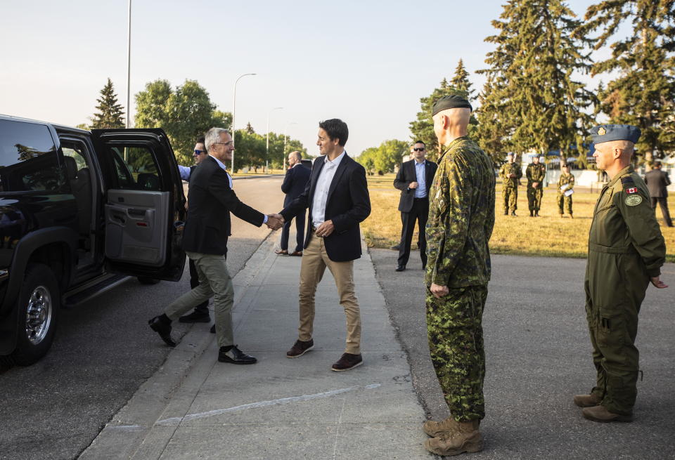 NATO Secretary General Jens Stoltenberg and Prime Minister Justin Trudeau meet at 4 Wing Cold Lake air base in Cold Lake Alta, on Friday Aug. 26, 2022. (Jason Franson /The Canadian Press via AP)