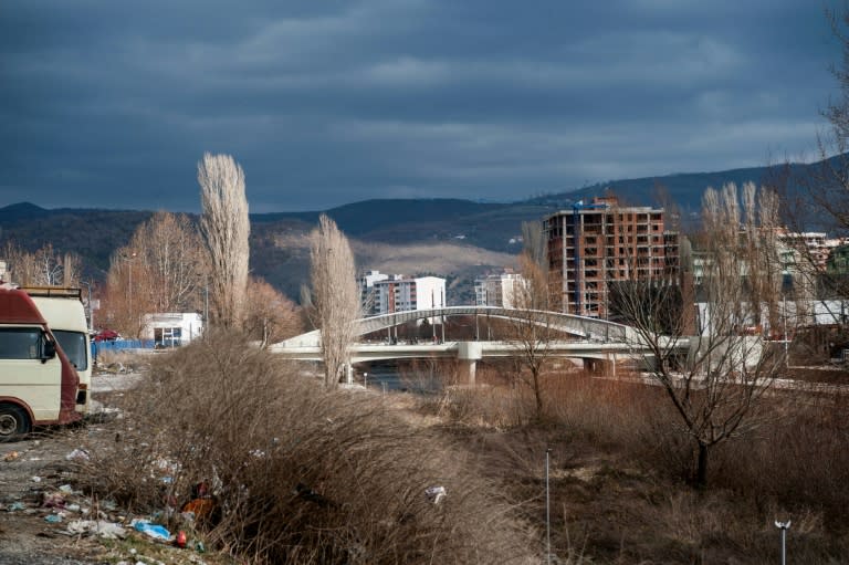 Supervised by international forces, the Mitrovica bridge remains a symbol of division, ten years after independence, and blocks of concrete are being placed on it