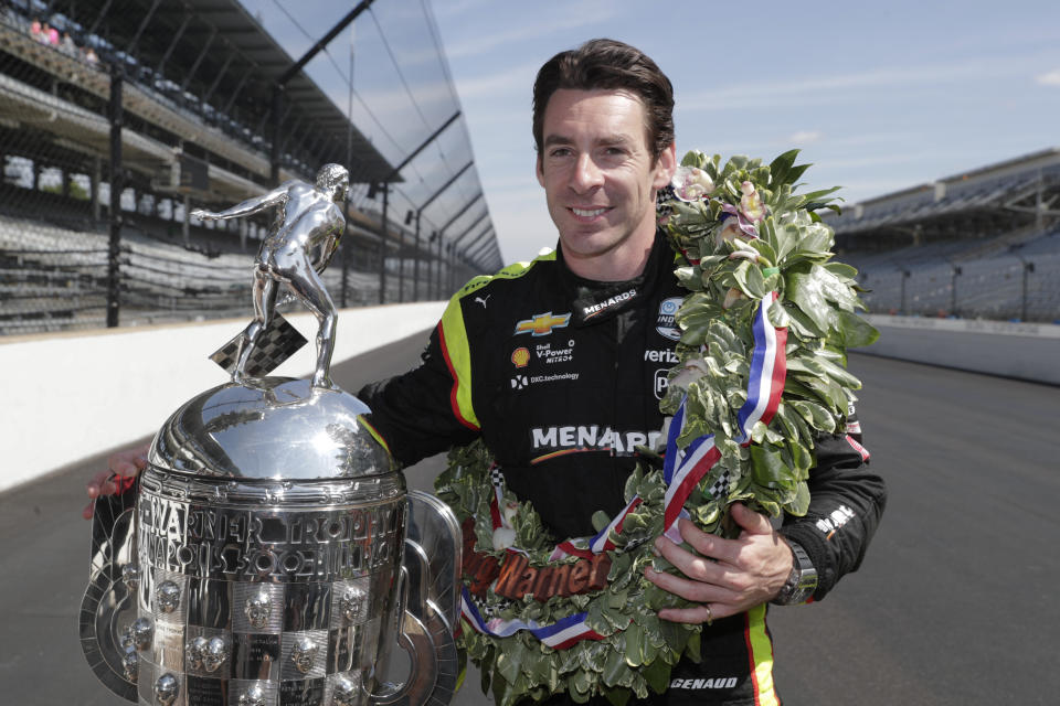 Simon Pagenaud, of France, winner of the 2019 Indianapolis 500 auto race, poses during the traditional winners photo session at the Indianapolis Motor Speedway in Indianapolis, Monday, May 27, 2019. (AP Photo/Michael Conroy)