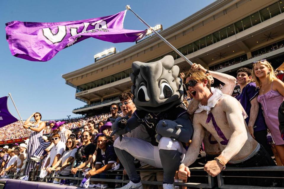 TCU mascot Super Frog hops into the student section during a college football game between the TCU Horned Frogs and the SMU Mustangs at Amon G. Carter Stadium in Fort Worth on Saturday, Sept. 23, 2023.