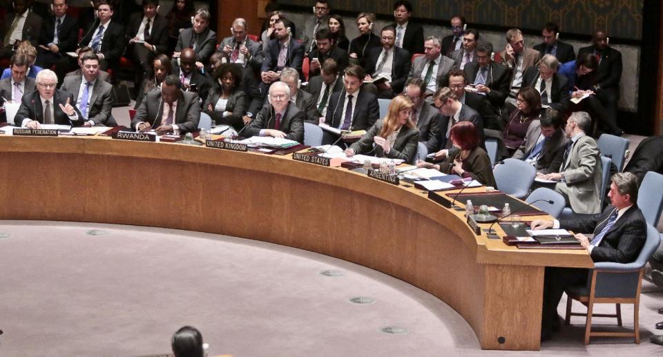 U.N. Russian Ambassador Vitaly Churkin, far left, speaks after listening to U.N. Ukraine Ambassador Yuriy Sergeyev, far right, during a U.N. Security Council meeting on Ukraine, Monday March 3, 2014 at U.N. headquarters. Ukraine's mission to the United Nations claimed Monday that 16,000 Russian troops have been deployed in the strategic Crimea region, while Russia's U.N. ambassador told an emergency Security Council meeting that Ukraine's fugitive president requested them. (AP Photo/Bebeto Matthews)