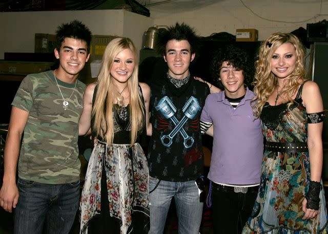 <p>Frazer Harrison/Getty</p> Joe Jonas, AJ Michalka, Kevin Jonas, Nick Jonas and Aly Michalka in July 2006