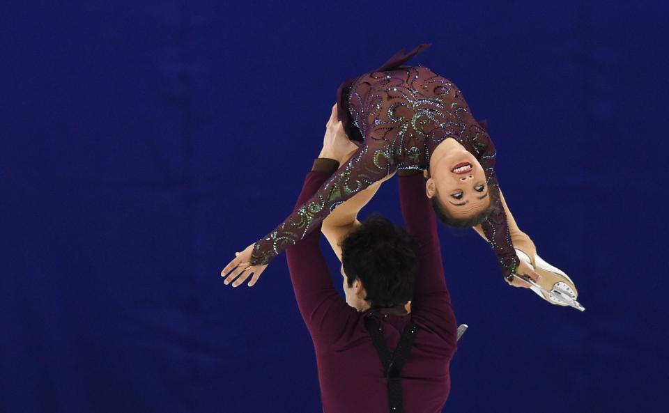 Amani Fancy (top) and  Christopher Boyadji of Britain perform during the pairs short program of the 2015 ISU World Figure Skating Championships at Shanghai Oriental Sports Center in Shanghai, on March 25, 2015.   AFP PHOTO / JOHANNES EISELE        (Photo credit should read JOHANNES EISELE/AFP via Getty Images)