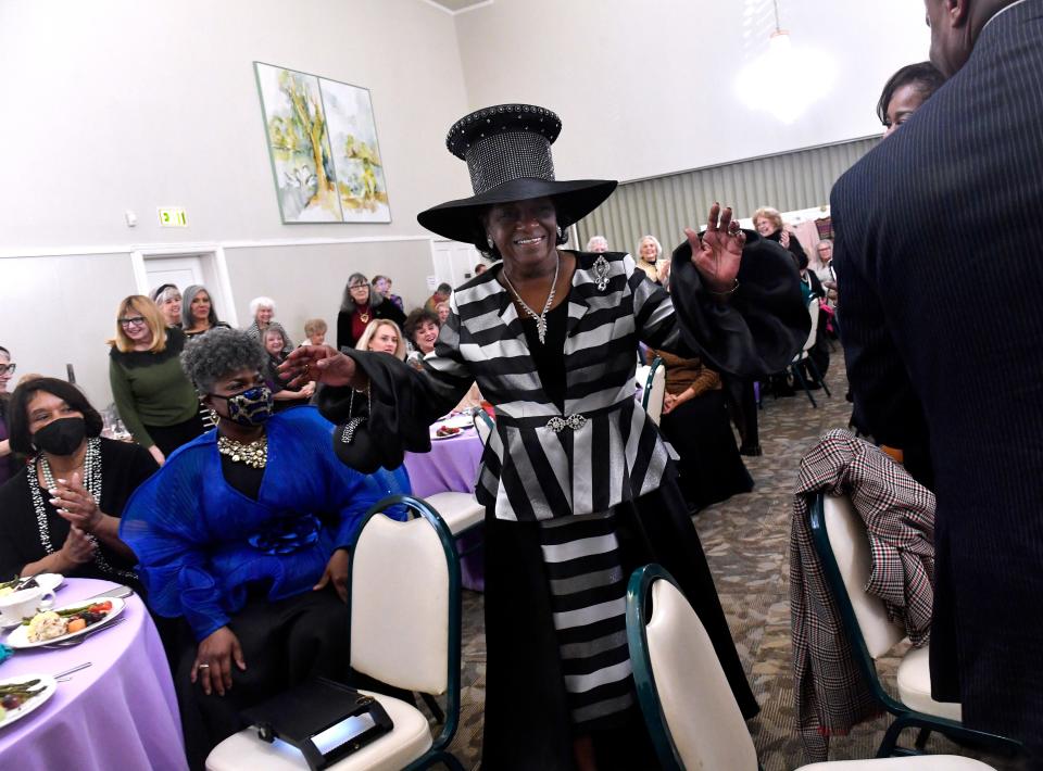 Dorothy Drones is applauded as she wears her 2020-2022 outfit with matching hat Feb. 18. The Abilene Woman's Club marked their 93rd year with their Historical Fashion Show luncheon.