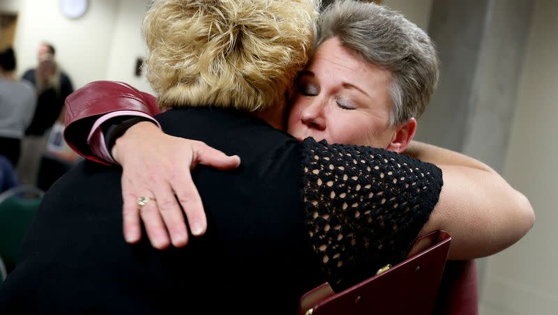 Carrie Moore, executive director of The Bradley Center for Grieving Children and Families, hugs Angela Child, mother of 19-year-old Angel Stringfellow who was ejected during a single vehicle rollover, after a press conference where family members shared stories about losing a child in motor vehicle crashes on Nov. 18, 2015.