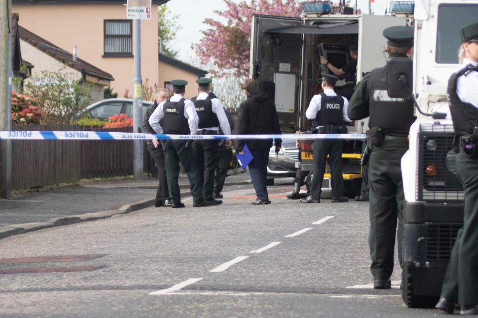 Police in attendance at Iniscarn Road in Londonderry where a suspect device was found (PA)