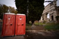 <p>Portable toilets near Porta Maggiore, Rome. (Photo: Filippo Monteforte/AFP/Getty Images) </p>