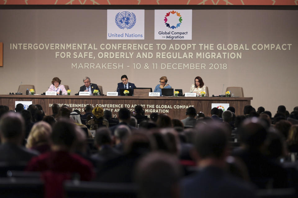 U.N. Secretary-General Antonio Guterres, 2nd left, and Moroccan Minister of Foreign Affairs and International Cooperation, Nasser Bourita, center, chair the opening session of a UN Migration Conference in Marrakech, Morocco, Monday, Dec.10, 2018. Top U.N. officials and government leaders from about 150 countries are uniting around an agreement on migration, while finding themselves on the defensive about the non-binding deal amid criticism and a walkout from the United States and some other countries. (AP Photo/Mosa'ab Elshamy)