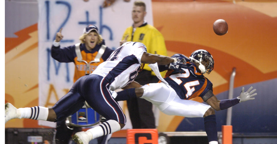 Champ Bailey, right, was hit by the Patriots' Benjamin Watson on the 1-yard line in the 2005 postseason. (Photo By RJ Sangosti/The Denver Post via Getty Images)