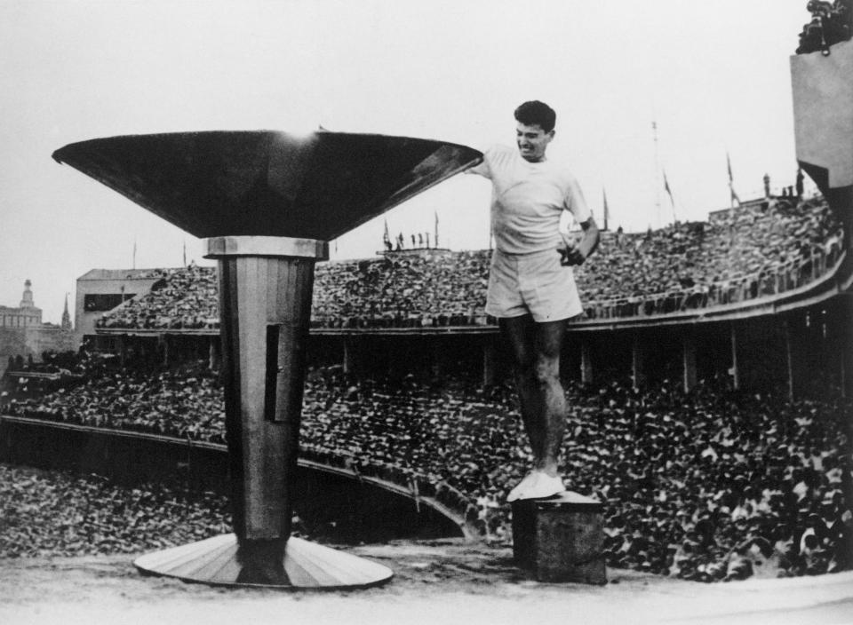 Ron Clarke of Australia lights the Olympic Torch at the opening ceremony of the 17th Olympic Games held in Melbourne in 1956.