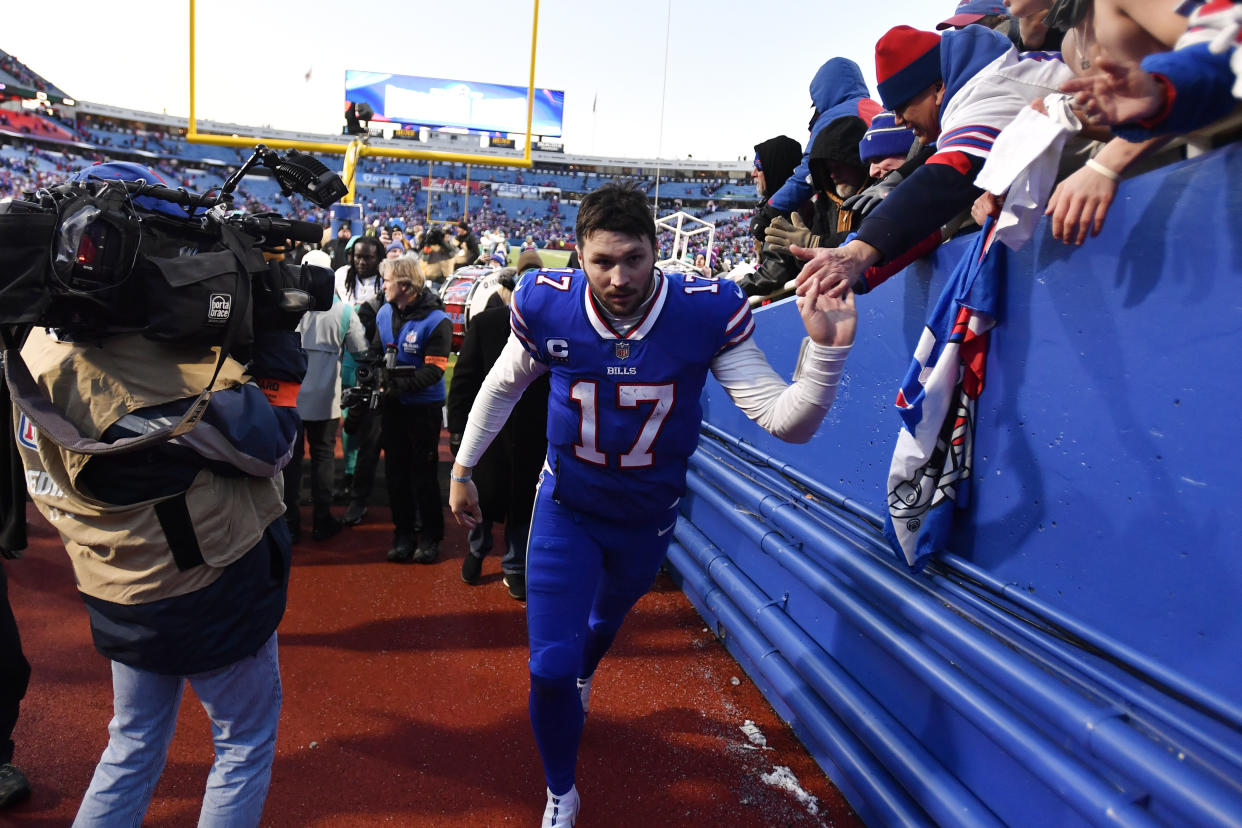 Buffalo Bills quarterback Josh Allen greets fans after an NFL wild-card playoff football game against the Miami Dolphins, Sunday, Jan. 15, 2023, in Orchard Park, N.Y. (AP Photo/Adrian Kraus)