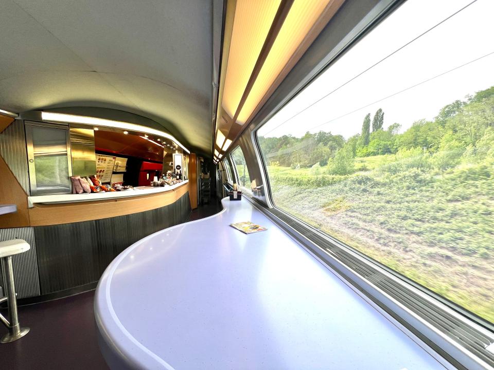 A table and the café bar on a TGV Lyria