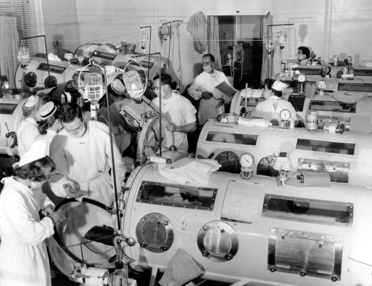 Critical-care patients in the emergency polio ward at Haynes Memorial Hospital in Boston in August 1955. <a href="https://newsroom.ap.org/detail/POLIOEPIDEMIC/ade0290b02e5da11af9f0014c2589dfb/photo?Query=polio%20iron%20lungs&mediaType=photo&sortBy=&dateRange=Anytime&totalCount=14&currentItemNo=6" rel="nofollow noopener" target="_blank" data-ylk="slk:Associated Press photo;elm:context_link;itc:0;sec:content-canvas" class="link ">Associated Press photo</a>