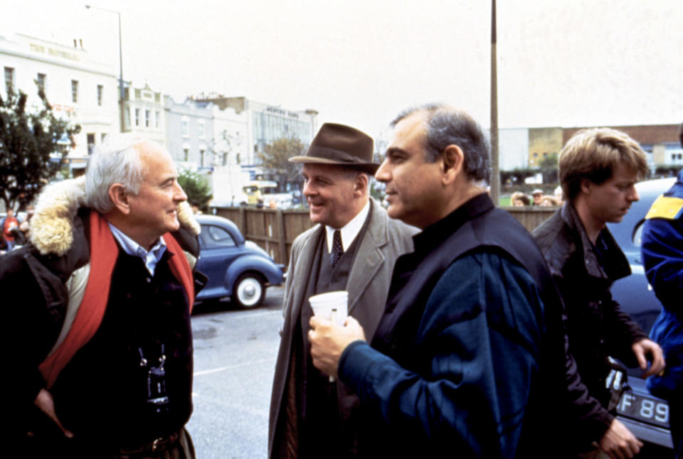 Director James Ivory (L) with actor Anthony Hopkins and producer Ismail Merchant on the set of 'The Remains of the Day' in 1993.