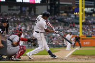 Detroit Tigers second baseman Jonathan Schoop connects for a RBI single during the fourth inning of the second baseball game of a doubleheader against the Cleveland Guardians, Monday, July 4, 2022, in Detroit. (AP Photo/Carlos Osorio)