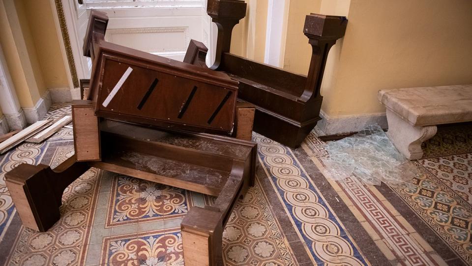 Broken furniture and shattered glass at the U.S. Capitol building in Washington, D.C., U.S., on Thursday, Jan. 7, 2021. Joe Biden was formally recognized by Congress as the next U.S. president early Thursday, ending two months of failed challenges by his predecessor, Donald Trump, that exploded into violence at the U.S. Capitol as lawmakers met to ratify the election result.